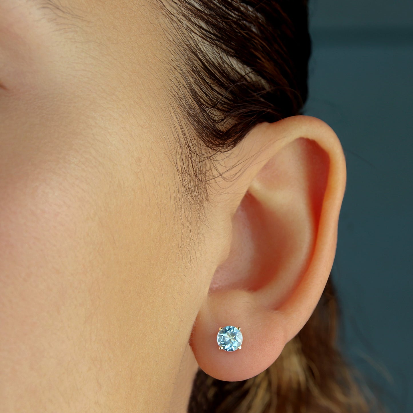 GIOVE MIO Exclusive 14kt Yellow Gold Stud Earrings with 1.21ct Sky Blue Topaz and Butterfly Backs. Illuminate your style with these radiant studs!