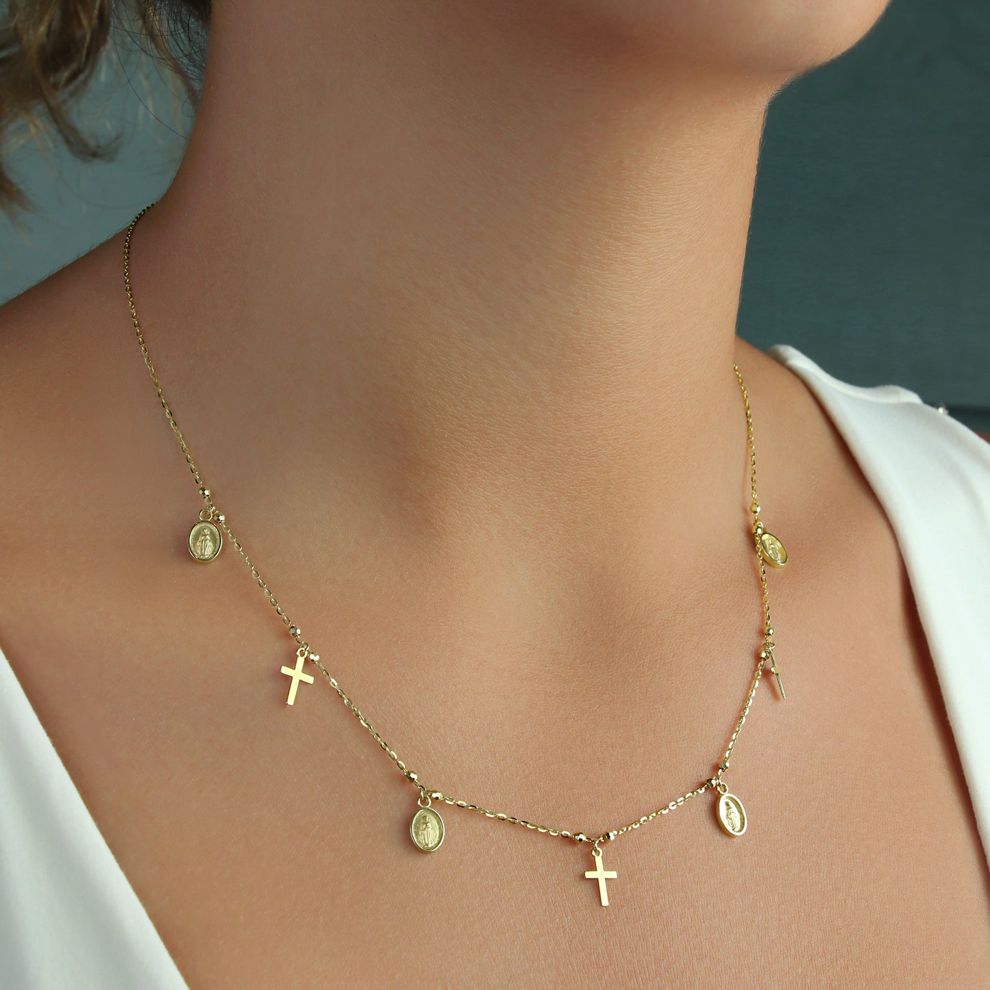 GIOVE MIO Exclusive Virgin Medals and Crosses Pendant Necklace, 14kt Yellow Gold, 45 CM. Reasa Clasp. Stud and Huggies Earrings available. Illuminate your spirit with this celestial jewel!