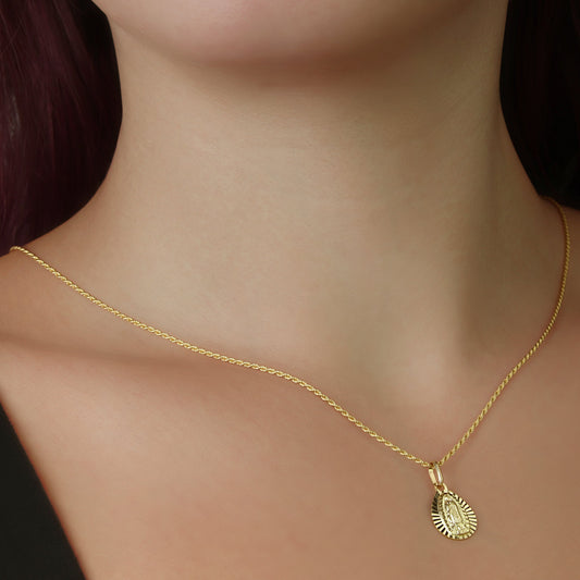 GIOVE MIO: 18kt Yellow Gold Virgin of Guadalupe Medal - Protection and devotion in a unique piece of jewelry. Make this sacred piece yours and showcase your faith with elegance!