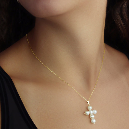 GIOVE MIO 14kt Yellow Gold Cross with 6 White Pearls and 1 Mother of Pearl. Elegant and meaningful pendant. Elevate your style with this exclusive piece. Stand out with sophistication!