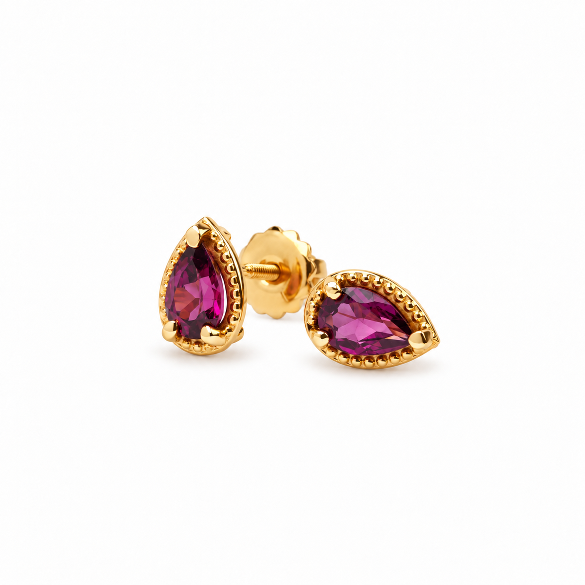 Par de studs con turmalinas corte pera y borde de oro amarillo 14 kt.