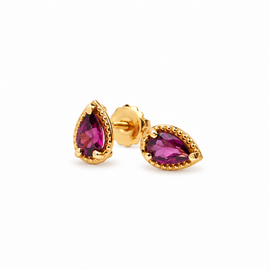 Par de studs con turmalinas corte pera y borde de oro amarillo 14 kt.